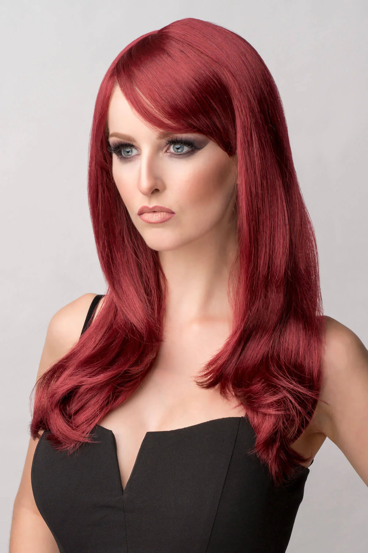 Long red wig in razor cut, face frame style: Megan